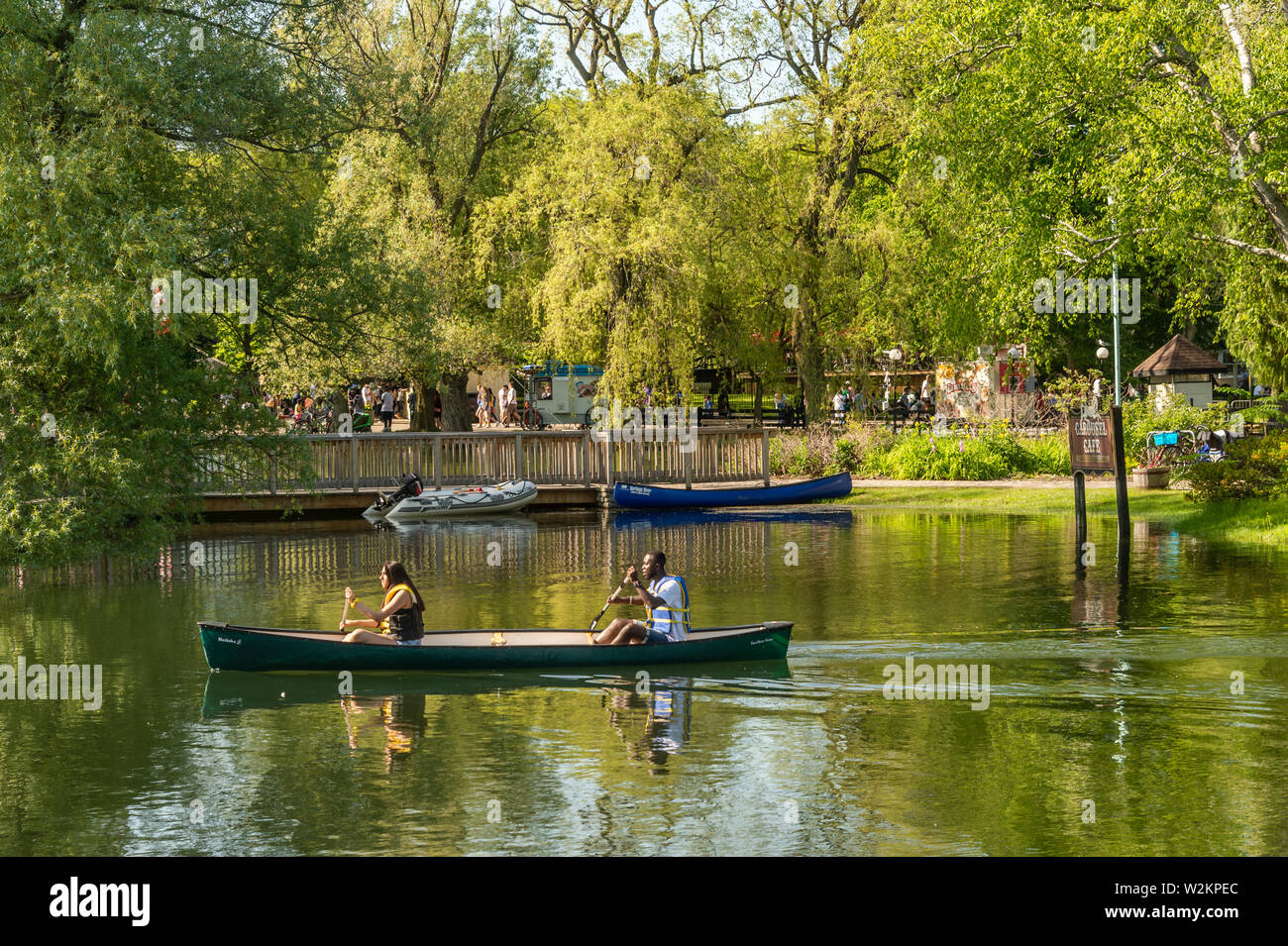 Toronto, CA - 22 June 2019: Two people rowing in a canoe on Lake Ontario at Toronto Centre Island. Stock Photo