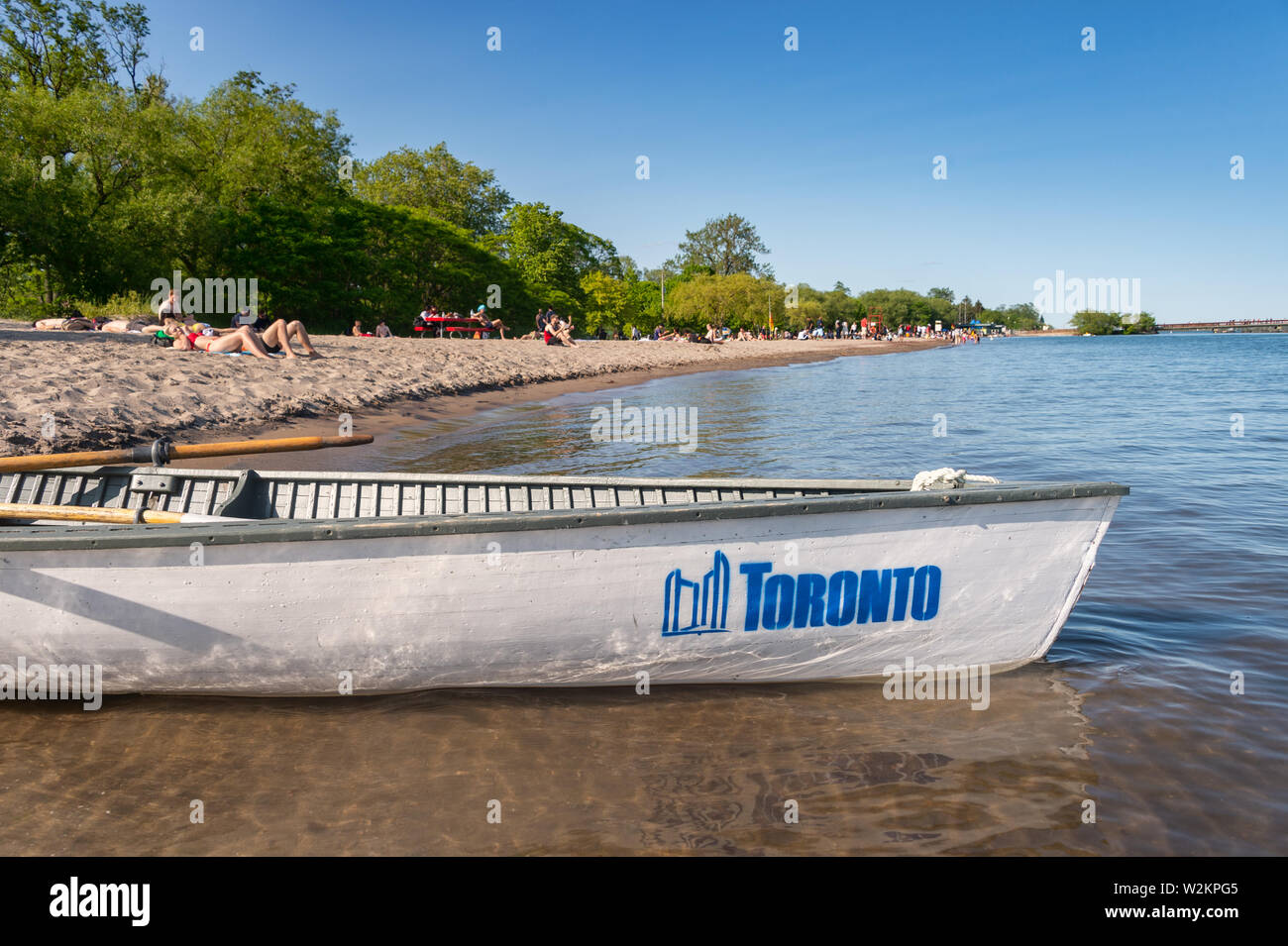 Toronto, CA - 23 June 2019: Small boat with Toronto city logo mooring at the Centre island beach. Stock Photo