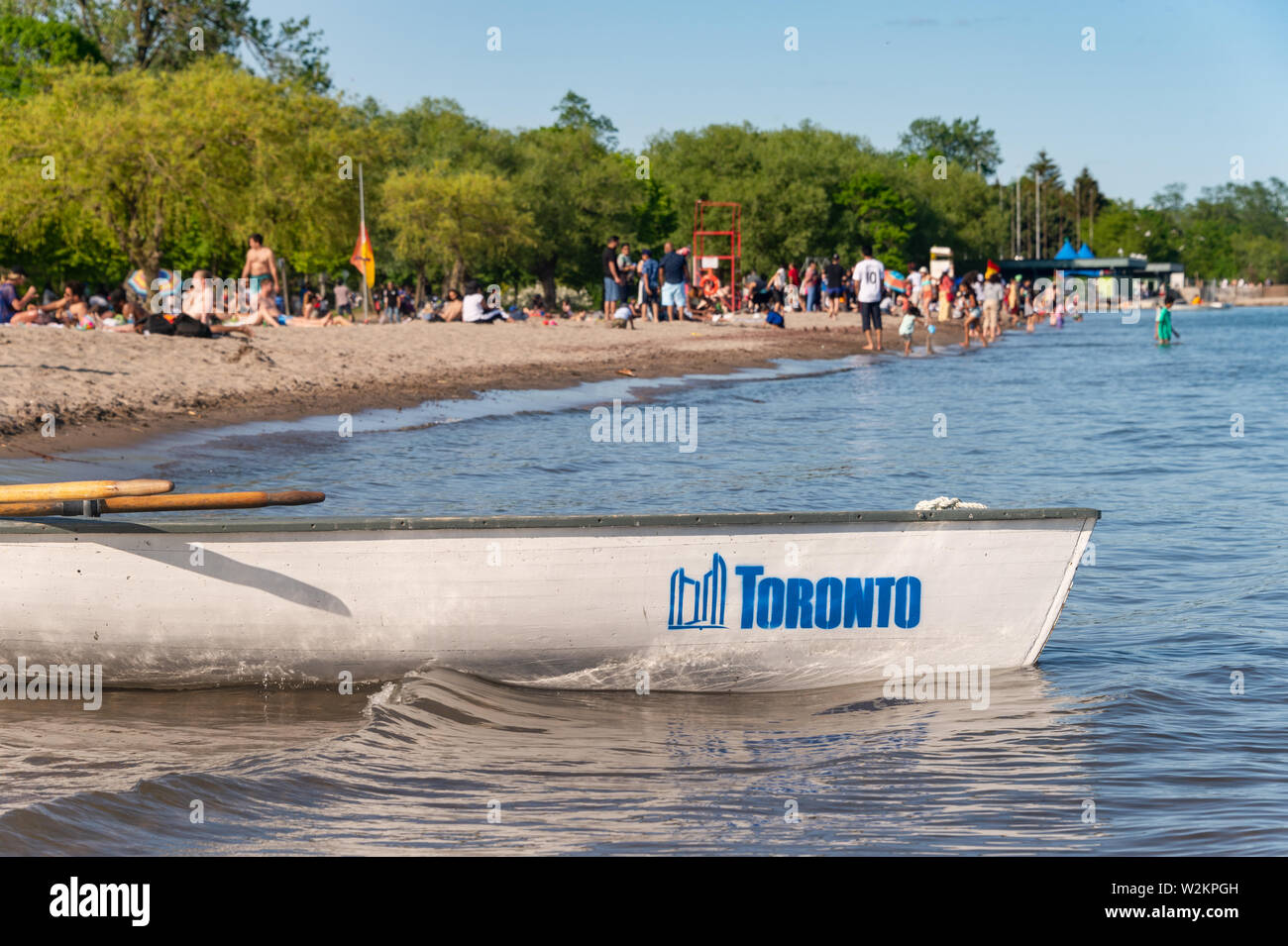 Toronto, CA - 23 June 2019: Small boat with Toronto city logo mooring at the Centre island beach. Stock Photo