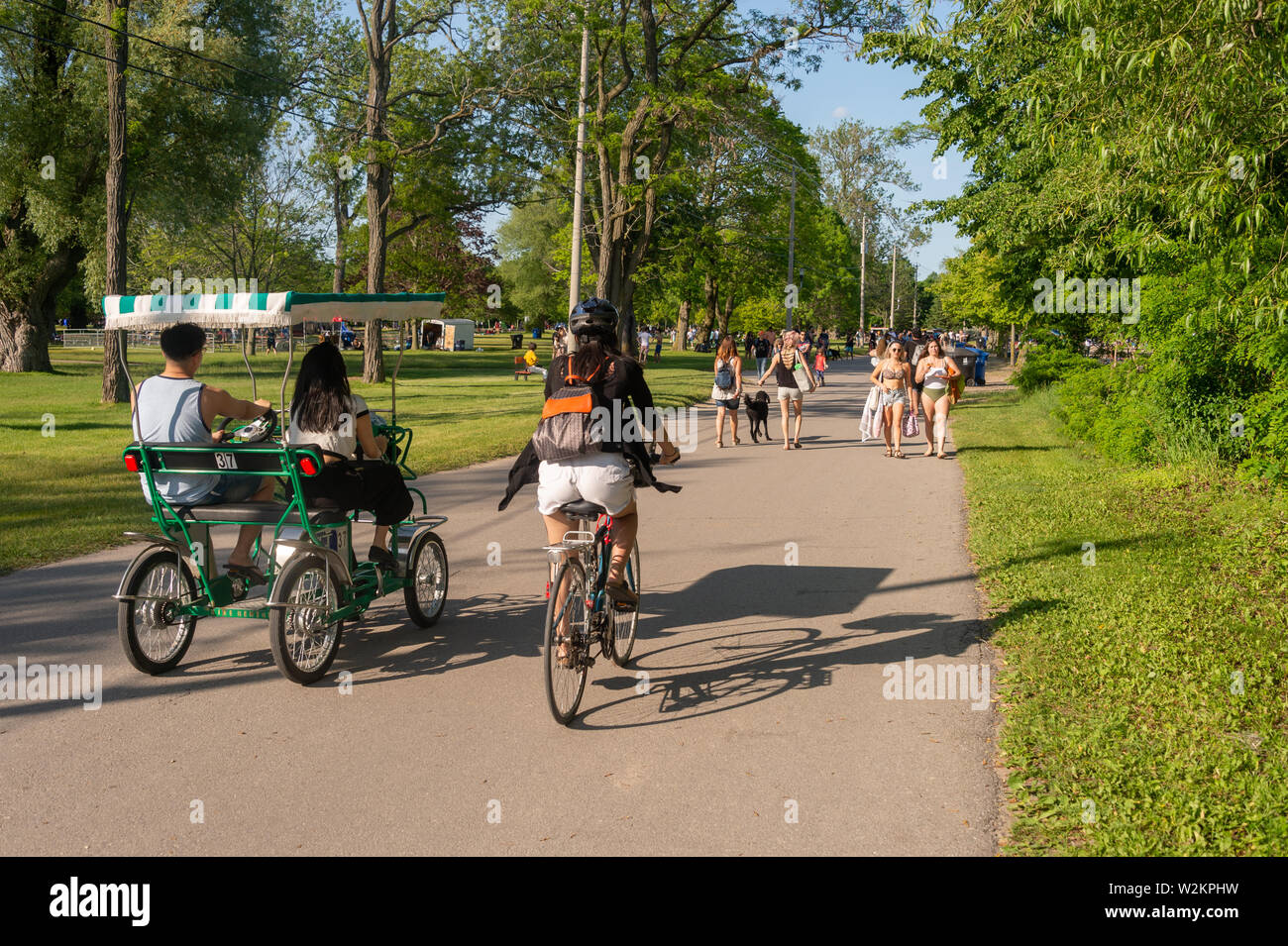 Toronto, CA - 22 June 2019: People riding bikes at Toronto Centre Island in summer. Stock Photo