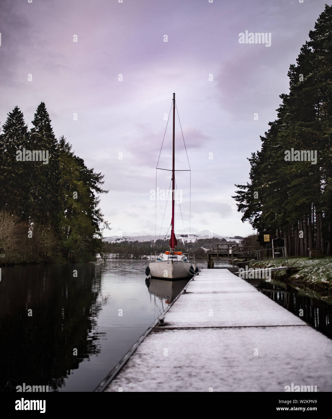April snow in Kytra, moored boat Stock Photo