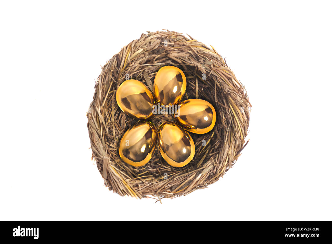 Golden eggs in bird nest on white Stock Photo - Alamy