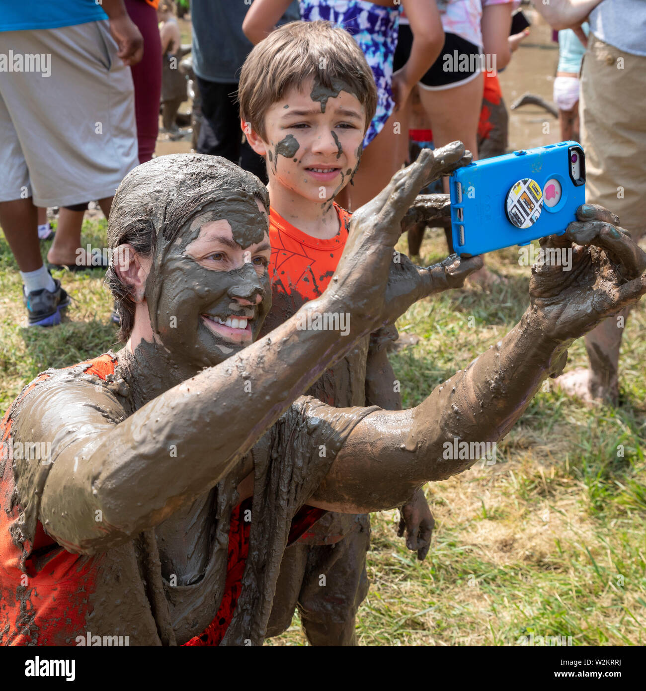 Westland, Michigan - Children age 12 and younger, along with some parents, play in the mud during the annual 'Youth Mud Day' organized by Wayne County Stock Photo