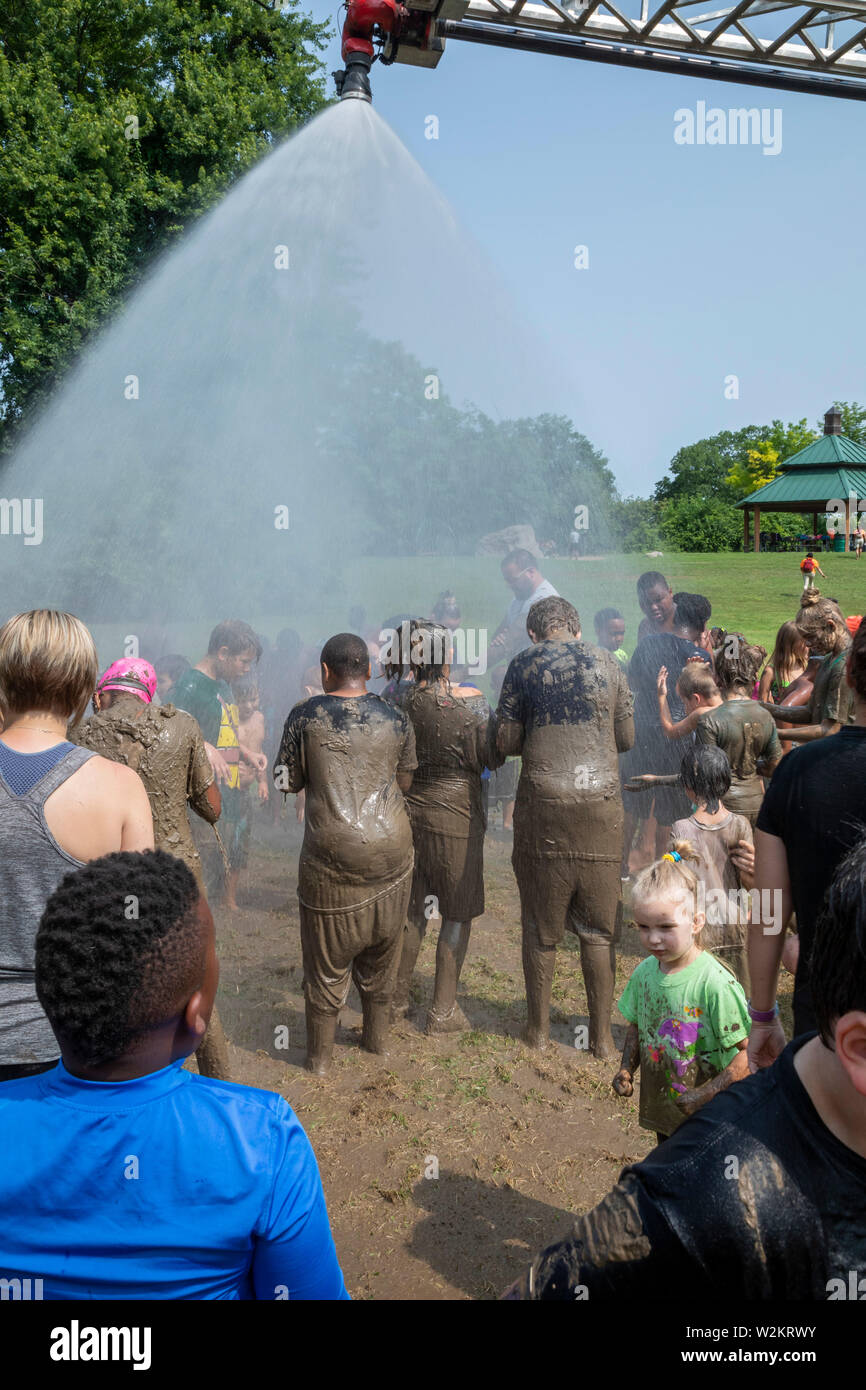 Westland, Michigan - Children age 12 and younger played in the mud during the annual 'Youth Mud Day' organized by Wayne County Parks. Afterwards, the Stock Photo