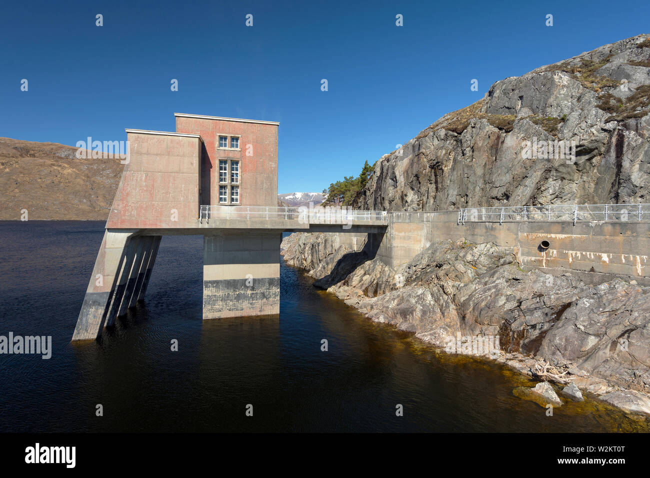 The intake tower at the Monar Dam at in Glen Strathfarrar, Highland Scotland.  The first double curvature arch dam built in Britain in 1963. Stock Photo