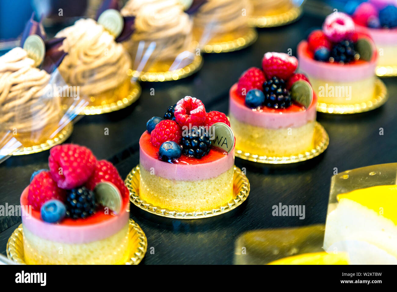 Raspberry mousse, cakes and desserts at Japanese WA Cafe and patisserie, Ealing Broadway, London, UK Stock Photo
