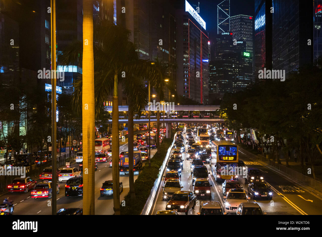 Evening traffic and buildings on Gloucester Road, Hong Kong, SAR, China Stock Photo