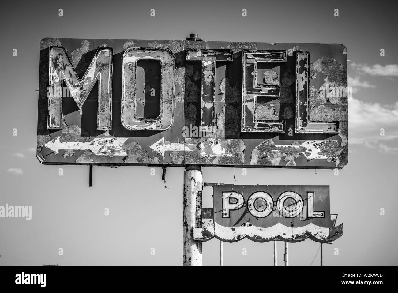 A dilapidated, vintage motel sign in the desert of Arizona Stock Photo