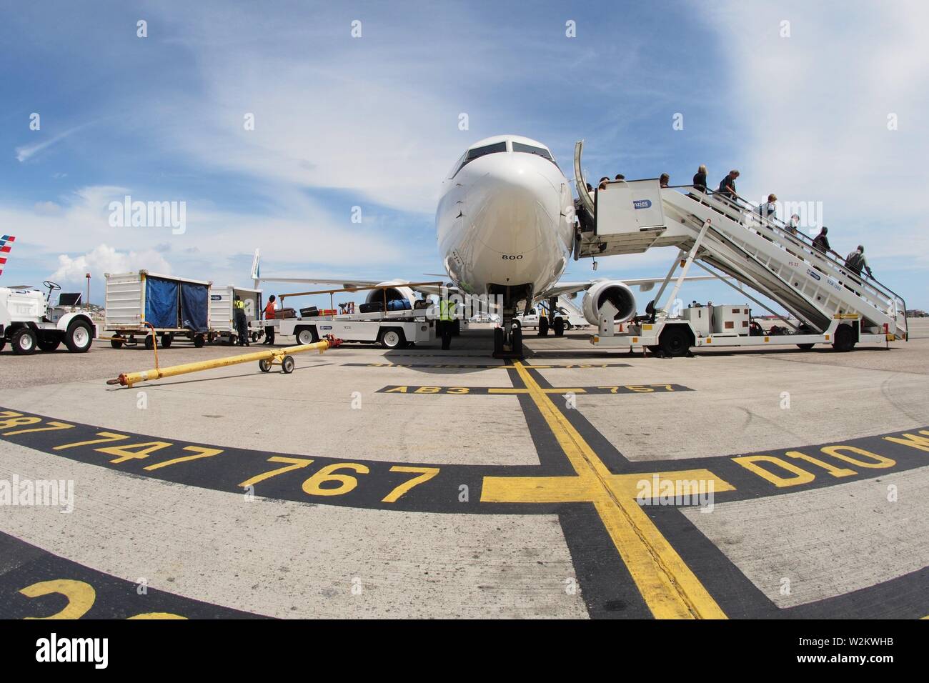Westjet from Toronto, disembarking at SXM, Princess Juliana International Airport, St Maartens, Caribbean. Stock Photo