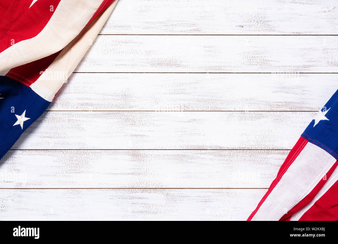 A crumpled American flag on a white plank background with copy space for holidays etc. Stock Photo