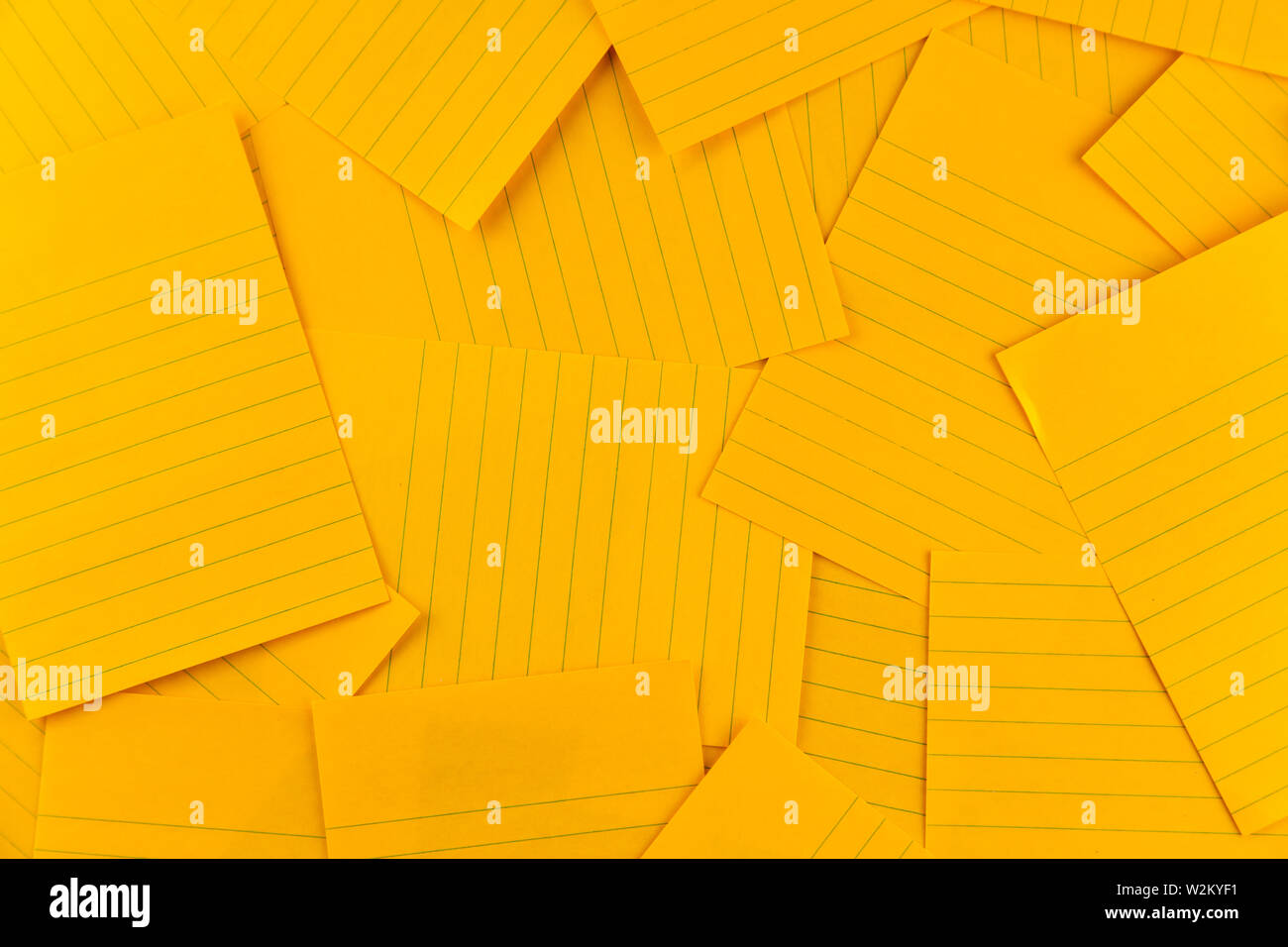 stack of blank rectangular paper orange sheet background pattern, top view with copy space. Stock Photo