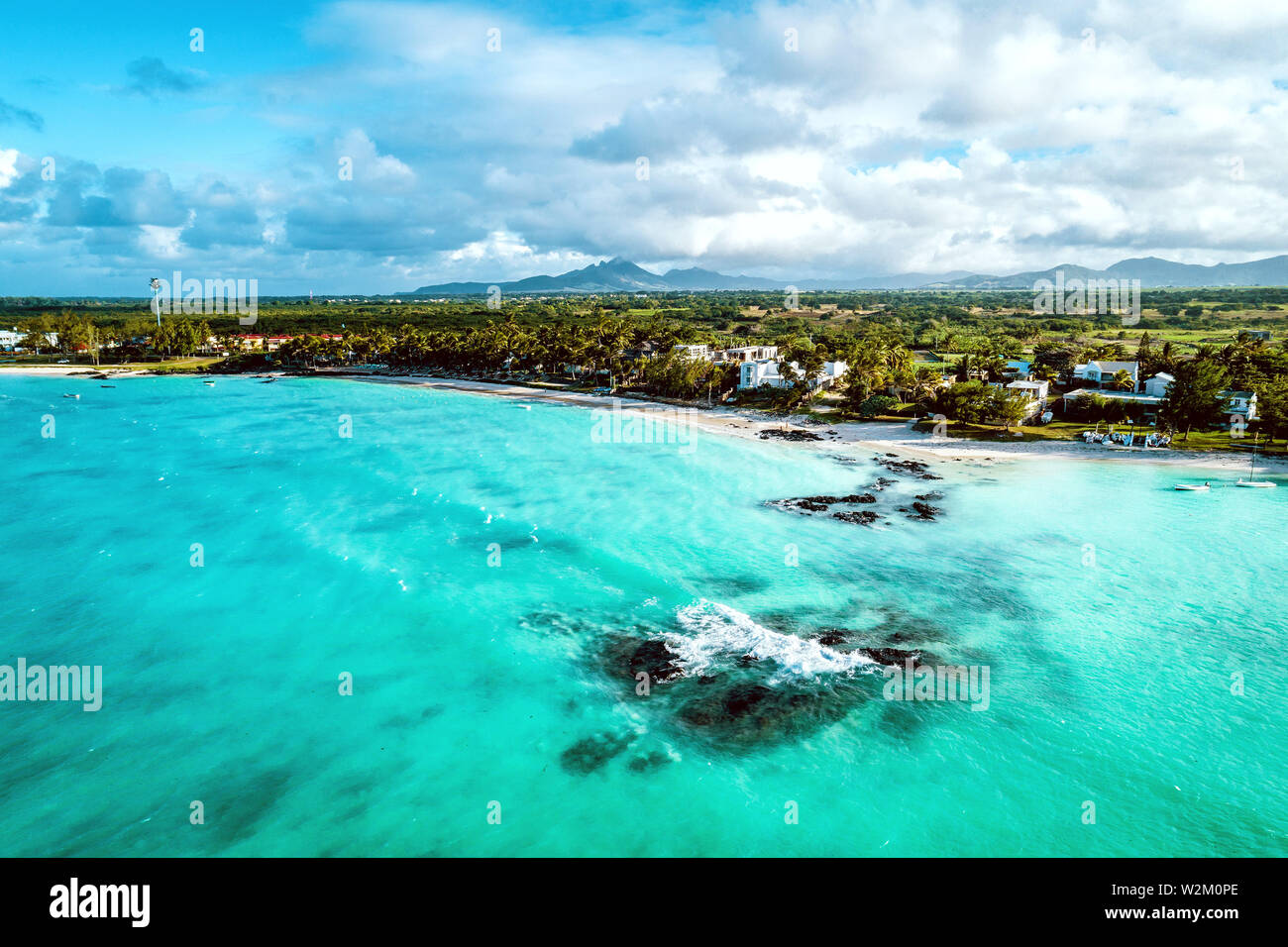 Aerial drone view at luxury resorts and coastline at Belle Mare beach ...