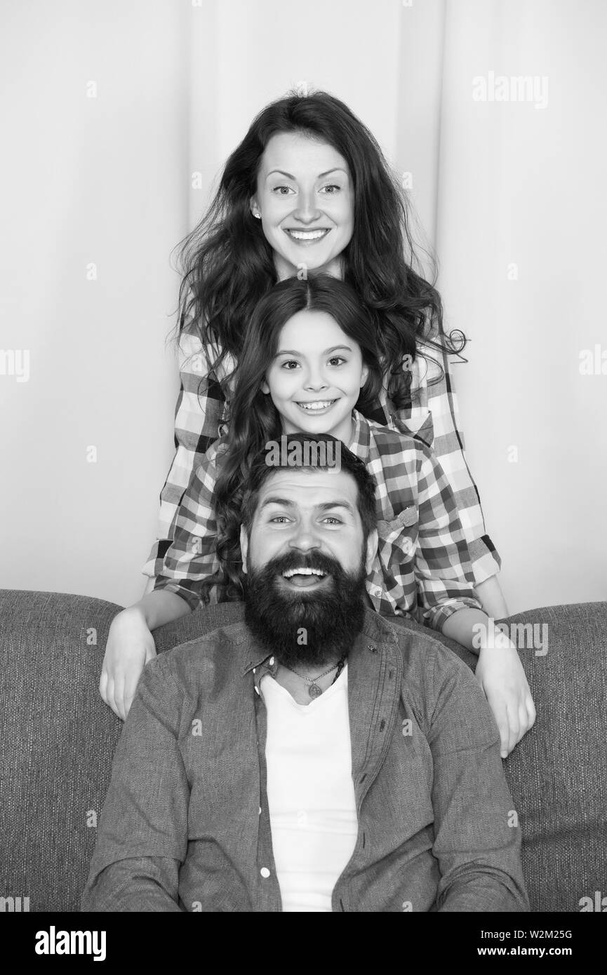 Family relaxing together on couch Black and White Stock Photos & Images