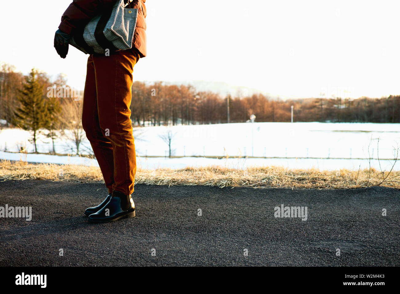 A view of someone's legs as they go walking in the countryside in Winter Stock Photo