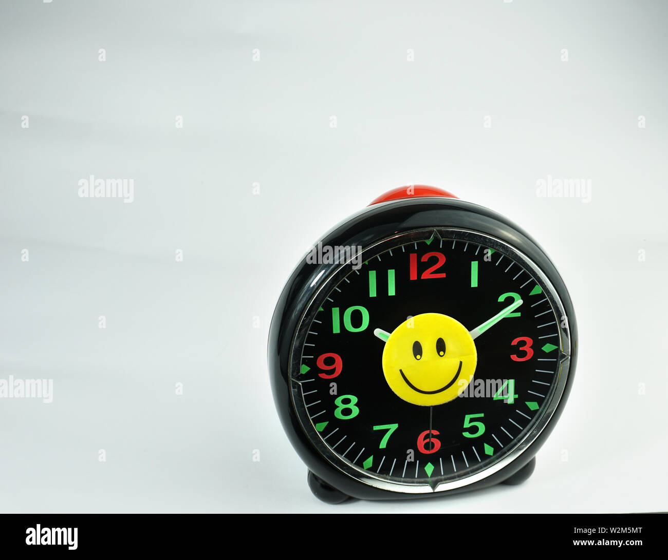 Smiley happiness happy face on wallet, blue cap, wallet, clock, pencil Stock Photo