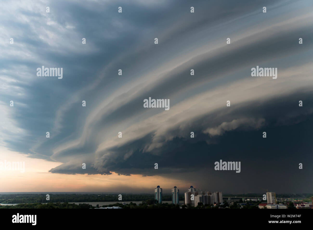 storm cloud is approaching the city. Bad weather. A dark cloud eclipses the sky. severe storm. Stock Photo