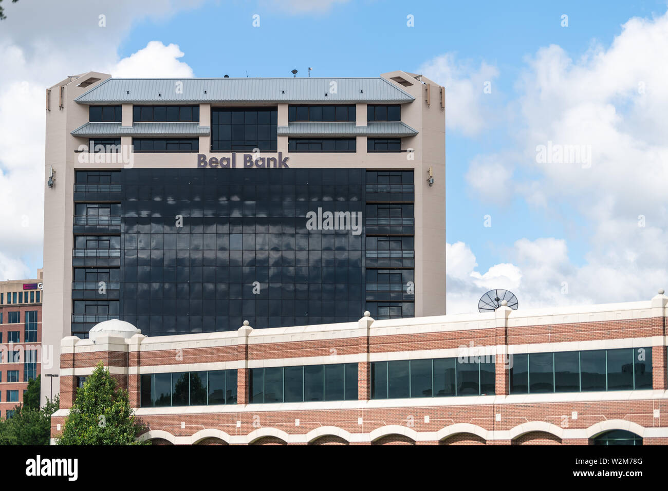 Dallas, USA - June 7, 2019: Downtown buildings and sign for Beal Bank in Texas City Stock Photo