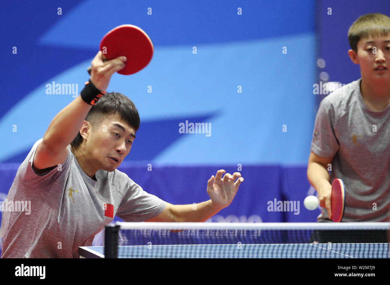 Naples, Italy. 9th July, 2019. Zhao Zihao (L) of China returns the ball  during the table tennis mixed doubles final competition between Wang  Yidi/Yu Ziyang of China and their teammates Fan Siqi/Zhao