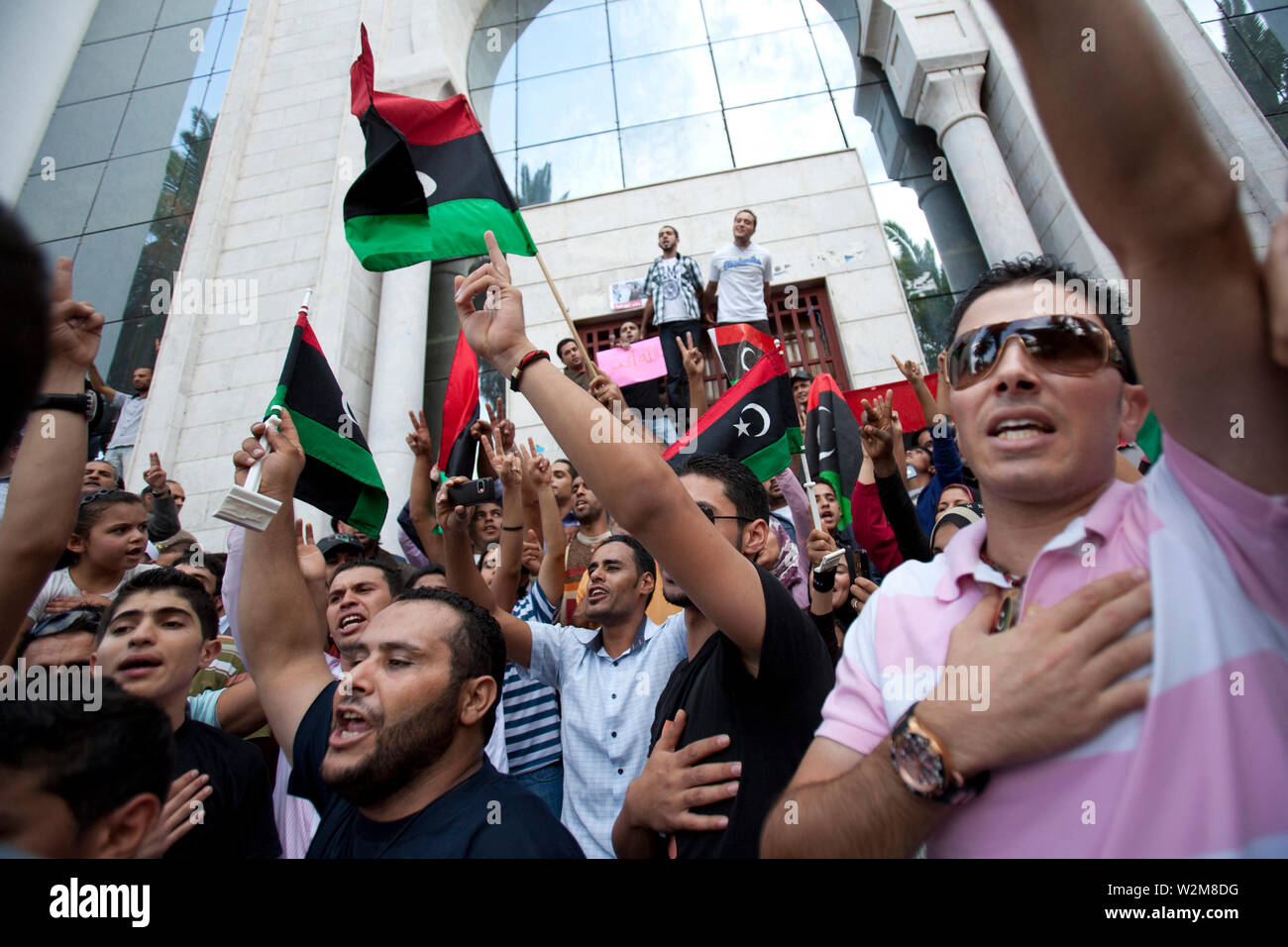 October 20, 2011 – Tunis, Tunisia - A number of Libyan nationals have gathered outside the Libyan embassy in Tunis, to celebrate the reports that Muammar Gaddafi had been captured, possibly killed in his home town of Sirt, where rebels have fought a grueling battle for weeks to crush his remaining armed loyalists. Photo credit: Benedicte Desrus Stock Photo