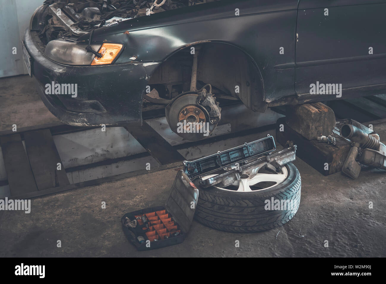 Car service. replace tires on wheels. Tire installation concept. old