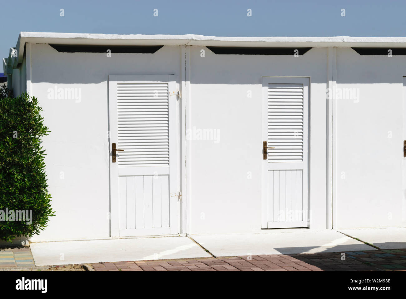 White color beach huts in Rimini beach resort, Italy Stock Photo