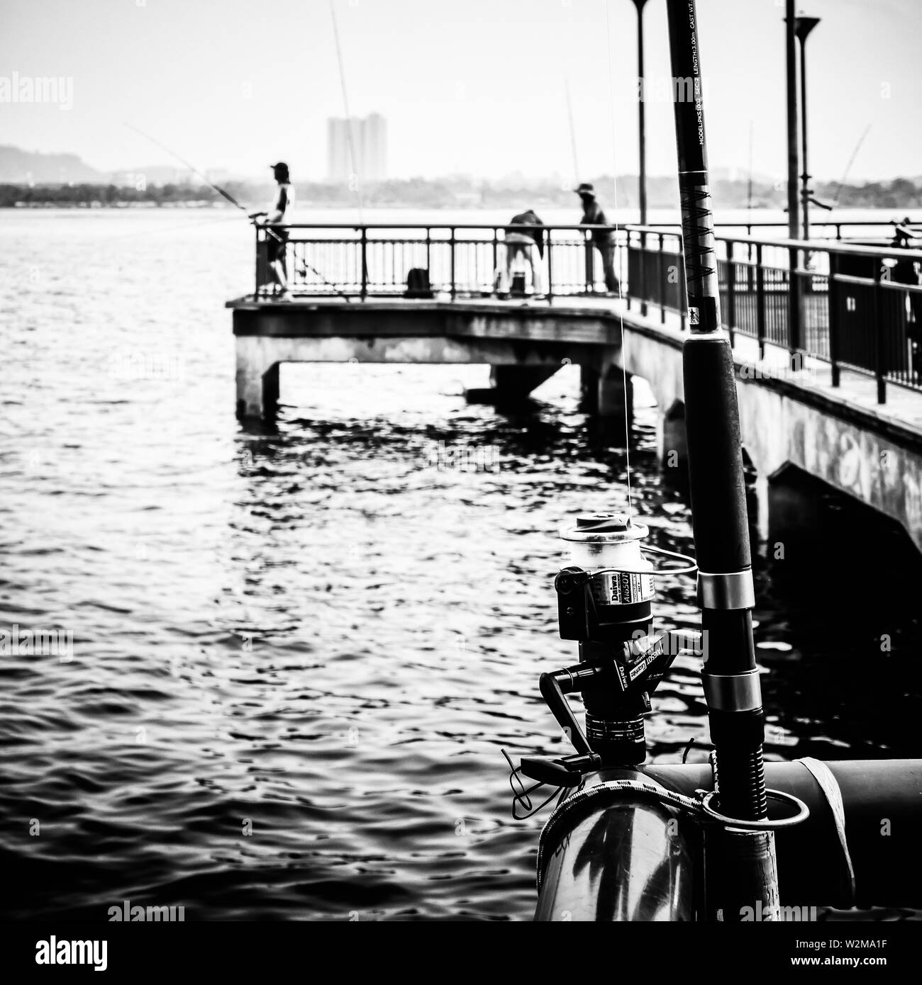 Singapore - Oct 6, 2018: Fishing at the Jetty in front of the Beaulieu House in Sembawang Park. Stock Photo