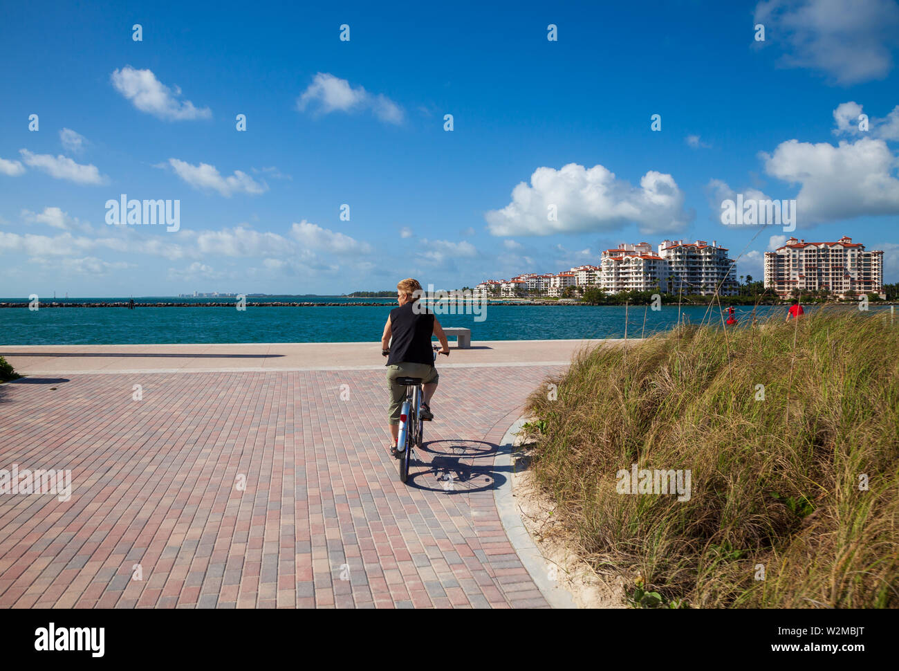 Model released female tourist riding a rental bicycle at Miami's South ...