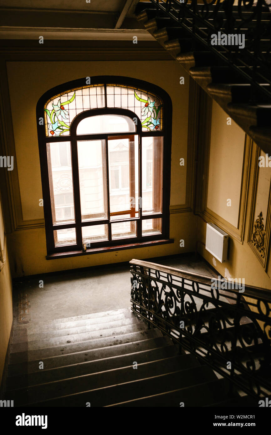 Inside A Residential Building With A Staircase And A Window Stock