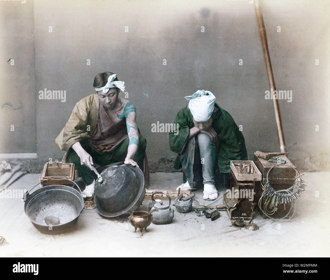1880s Japan - Japanese Tinker ] — A tinker mending pots, kettles