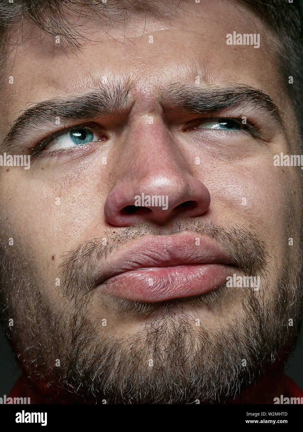 Close up portrait of young and emotional caucasian man. Highly detail ...