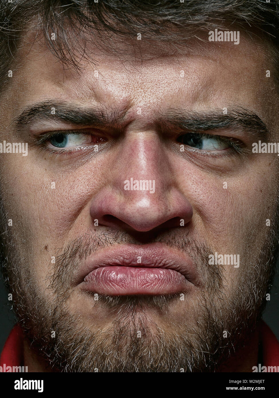 Close up portrait of young and emotional caucasian man. Highly detail ...