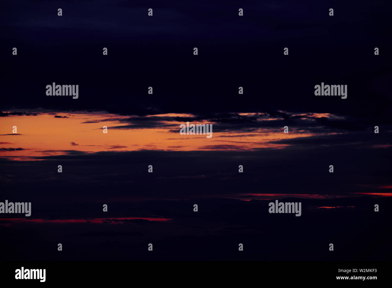 Beautiful sunset - dark sky with clouds and sunlight Stock Photo - Alamy