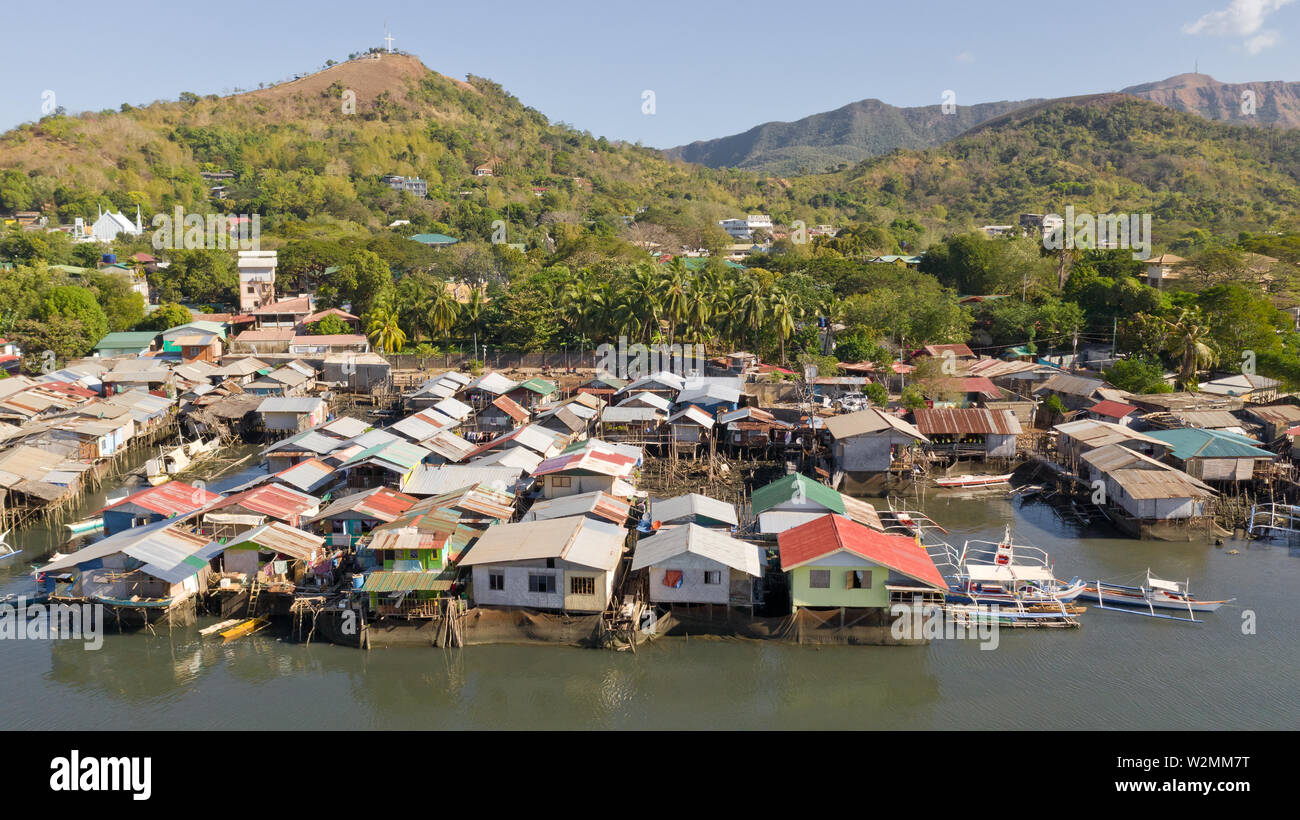 Aerial view Coron city with slums and poor district. Palawan.Wooden houses near the water.Poor neighborhoods and slums in the city of Coron aerial view Stock Photo