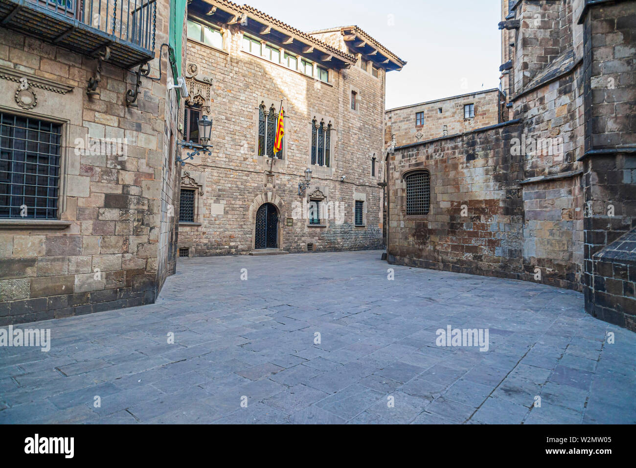Barcelona, Ancient street in gothic quarter, medieval buildings, cathedral and casa dels canonges. Stock Photo