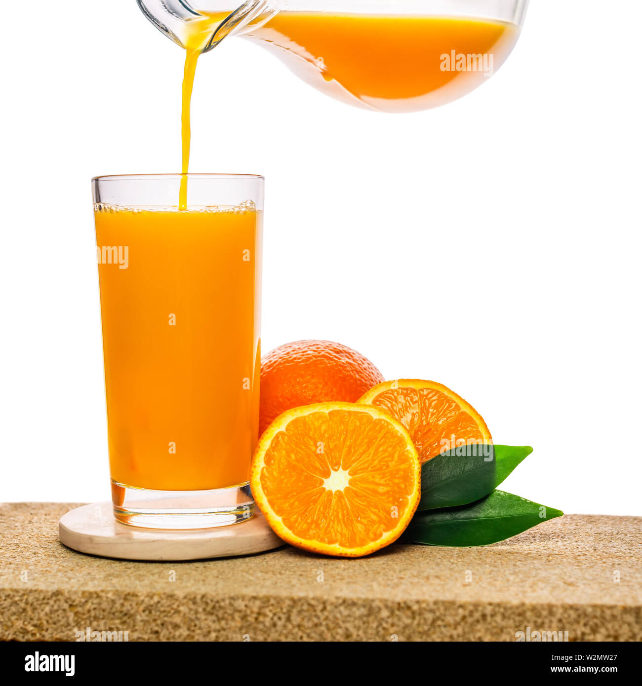 Pouring orange juice from a glass jug … – License Images – 138447 ❘  StockFood