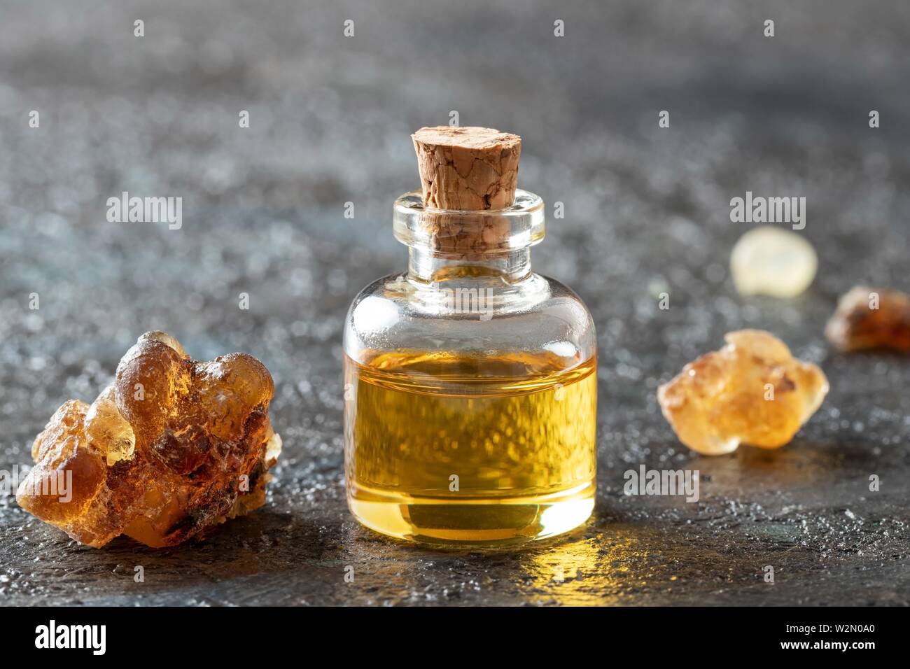 A bottle of frankincense essential oil and resin Stock Photo Alamy