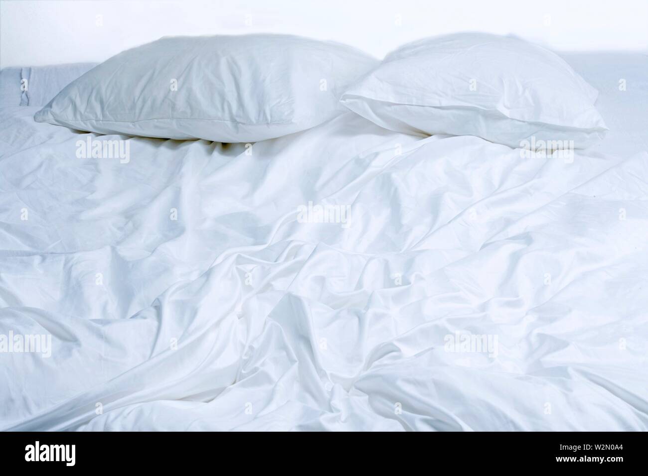 View of unmade bed. Stock Photo