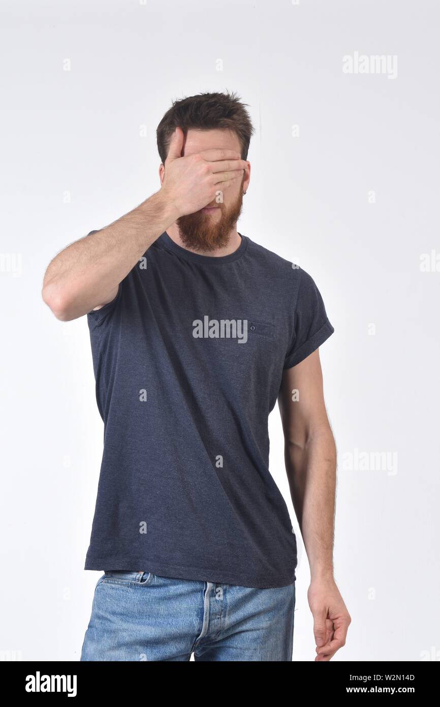 man cover his eyes with his hand Stock Photo - Alamy