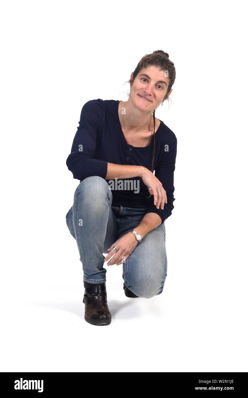full portrait of woman sitting in the floor on white Stock Photo - Alamy