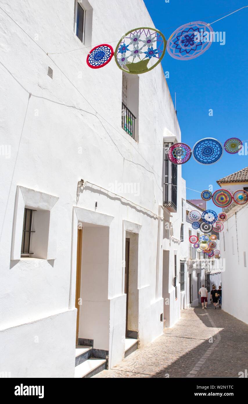 Andalusian village decorated with crochet crafts. White village Arcos de la Frontera, Cadiz, Andalusia, Spain. Stock Photo