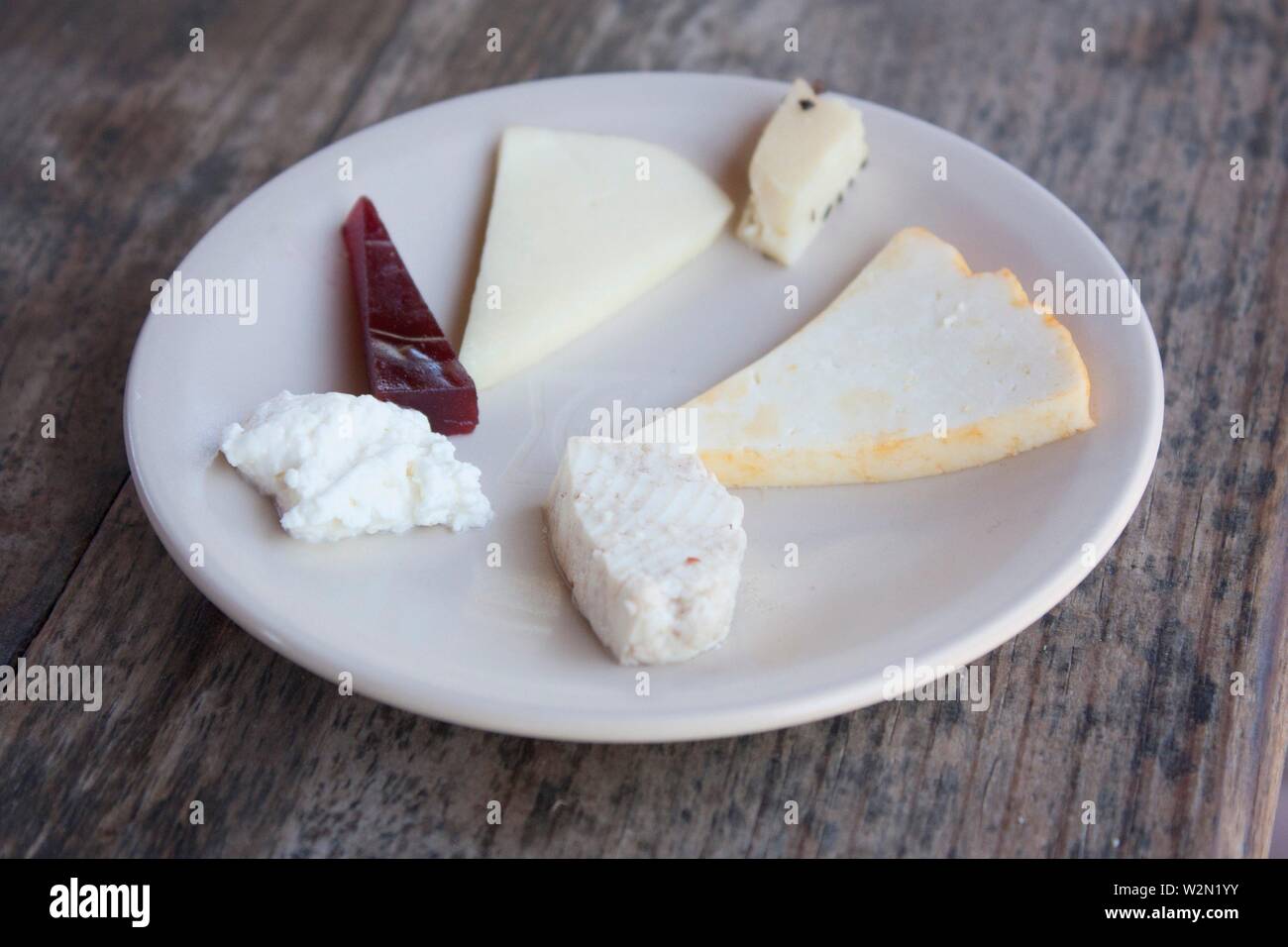 Cheese plate of various types, enchilado, ate, blue cheese, goat cheese