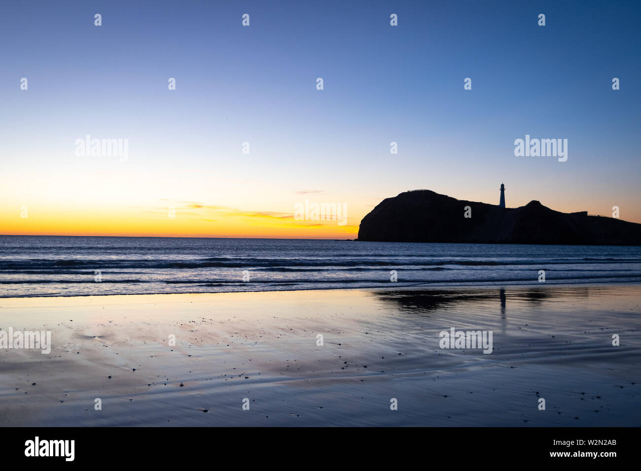 Pre-dawn light over Pacific Ocean at Castlepoint, Wairarapa, North Island, New Zealand Stock Photo