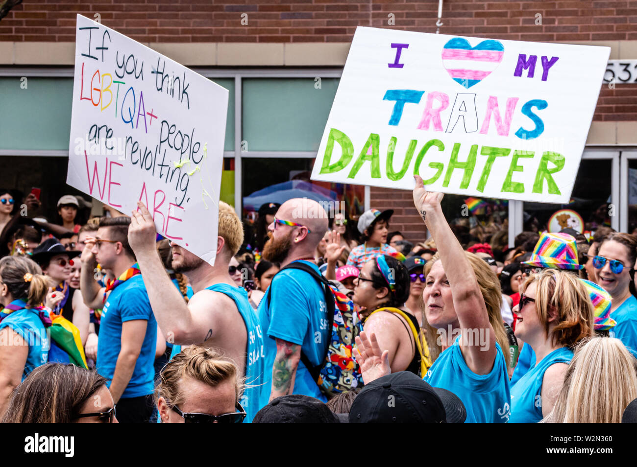 Lakeview, Chicago-June 30, 2019: A mother carries a sign that reads 'I  my trans daughter' while marching in the Gay Pride parade. Stock Photo