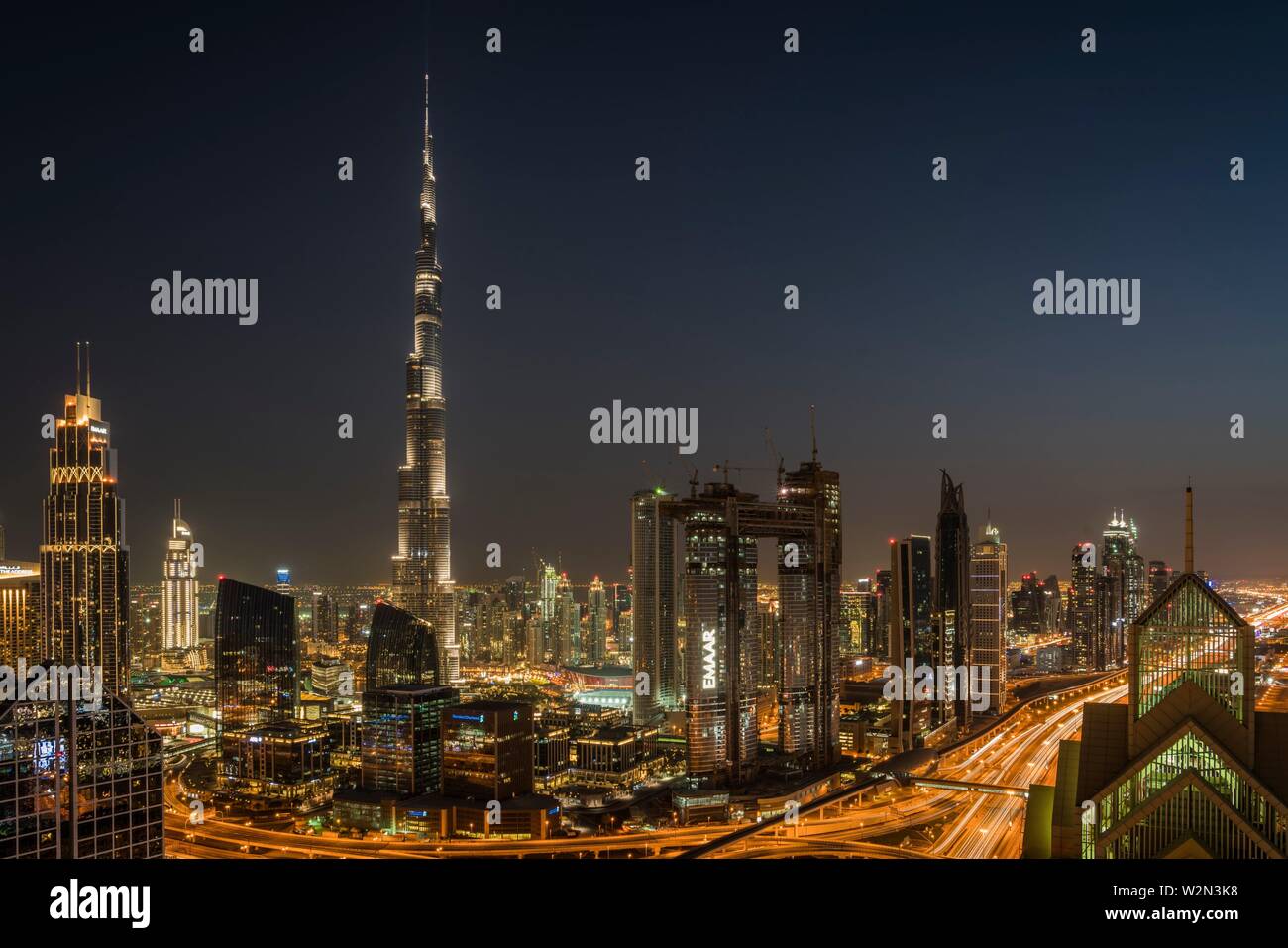 The Burj Khalifa and city skyline at night in downtown Dubai, UAE, Middle East. Stock Photo
