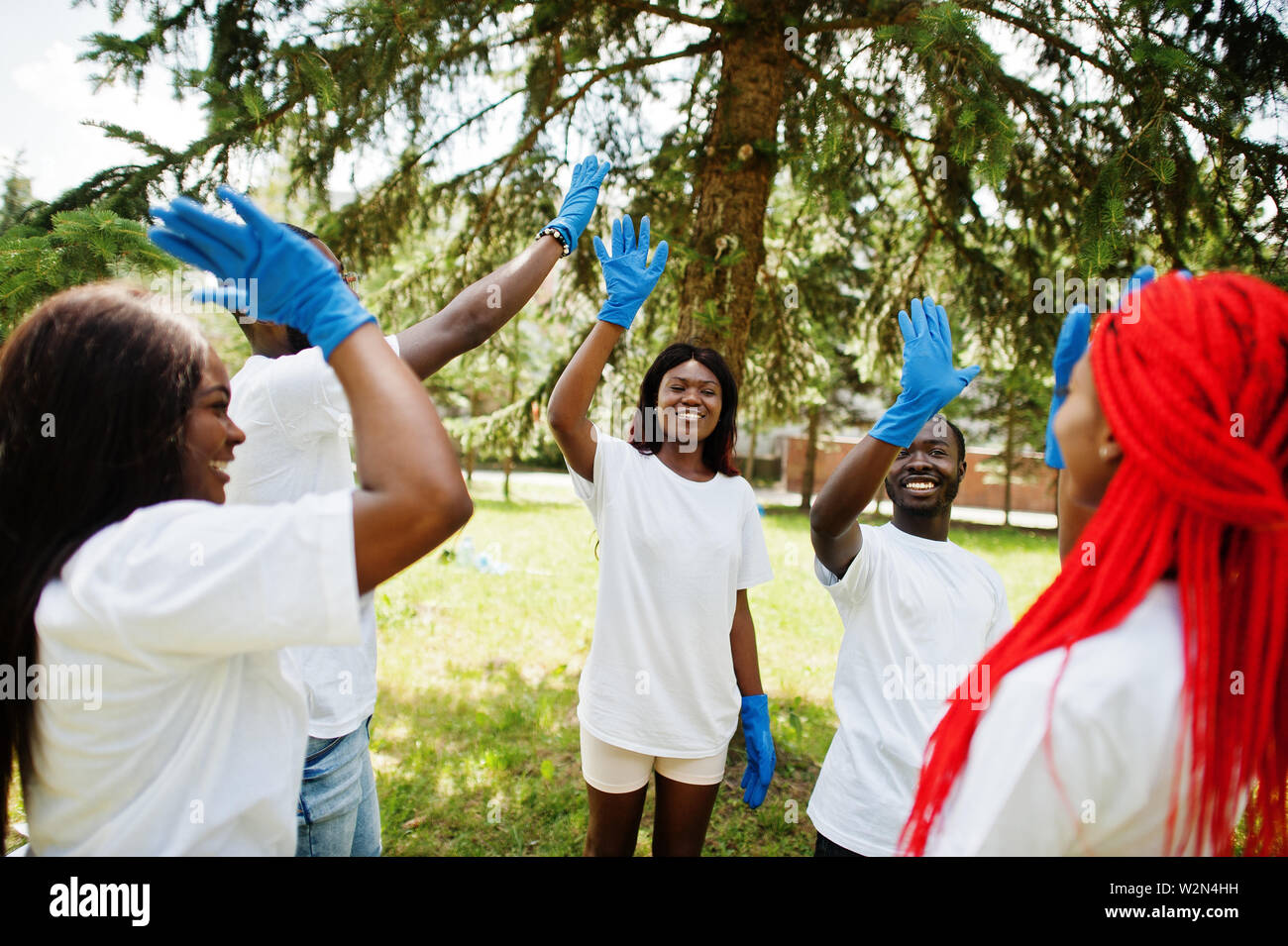 Teens put hands together hi-res stock photography and images - Alamy