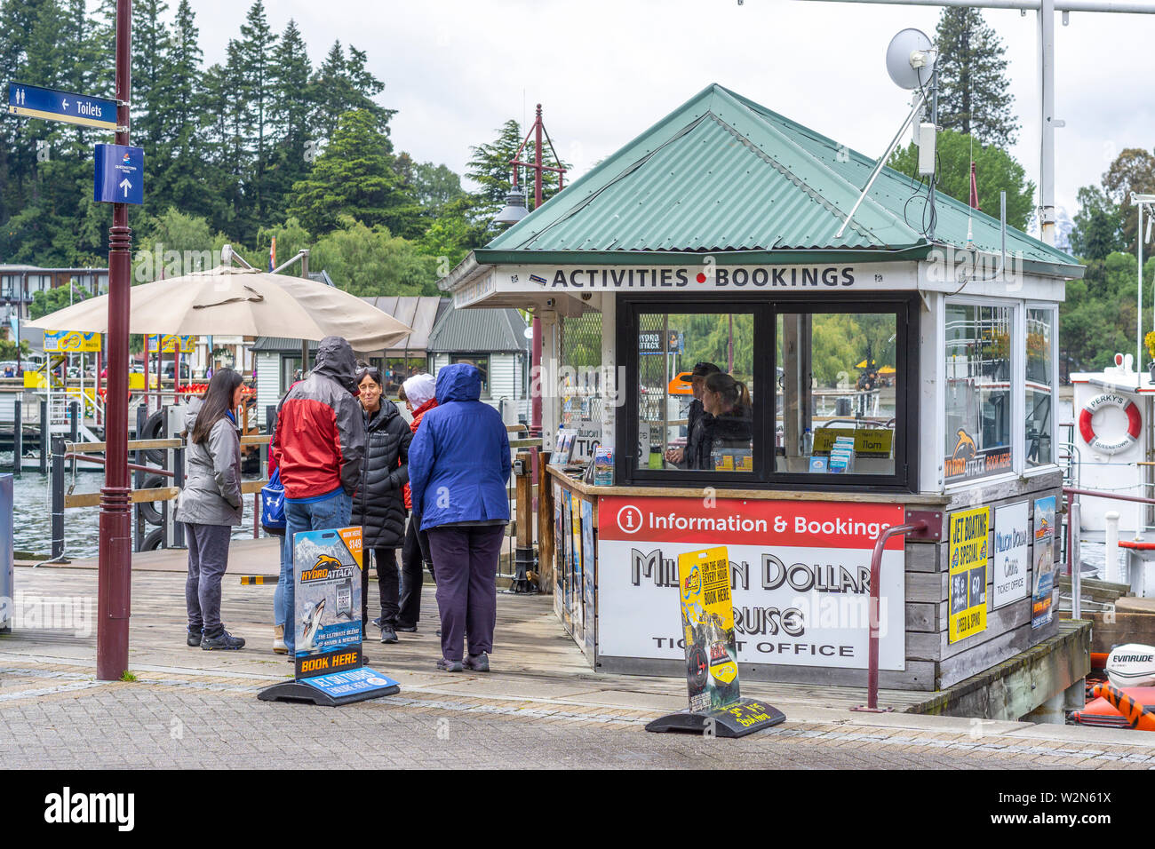 Tourist queuing at ticket booth at Queenstown wharf, Queenstown, New Zealand Stock Photo