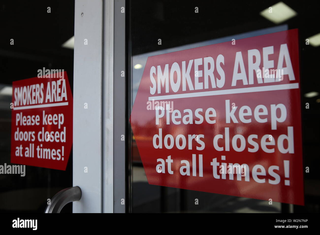 Smokers Area Please Keep Doors Closed At All Times Stock
