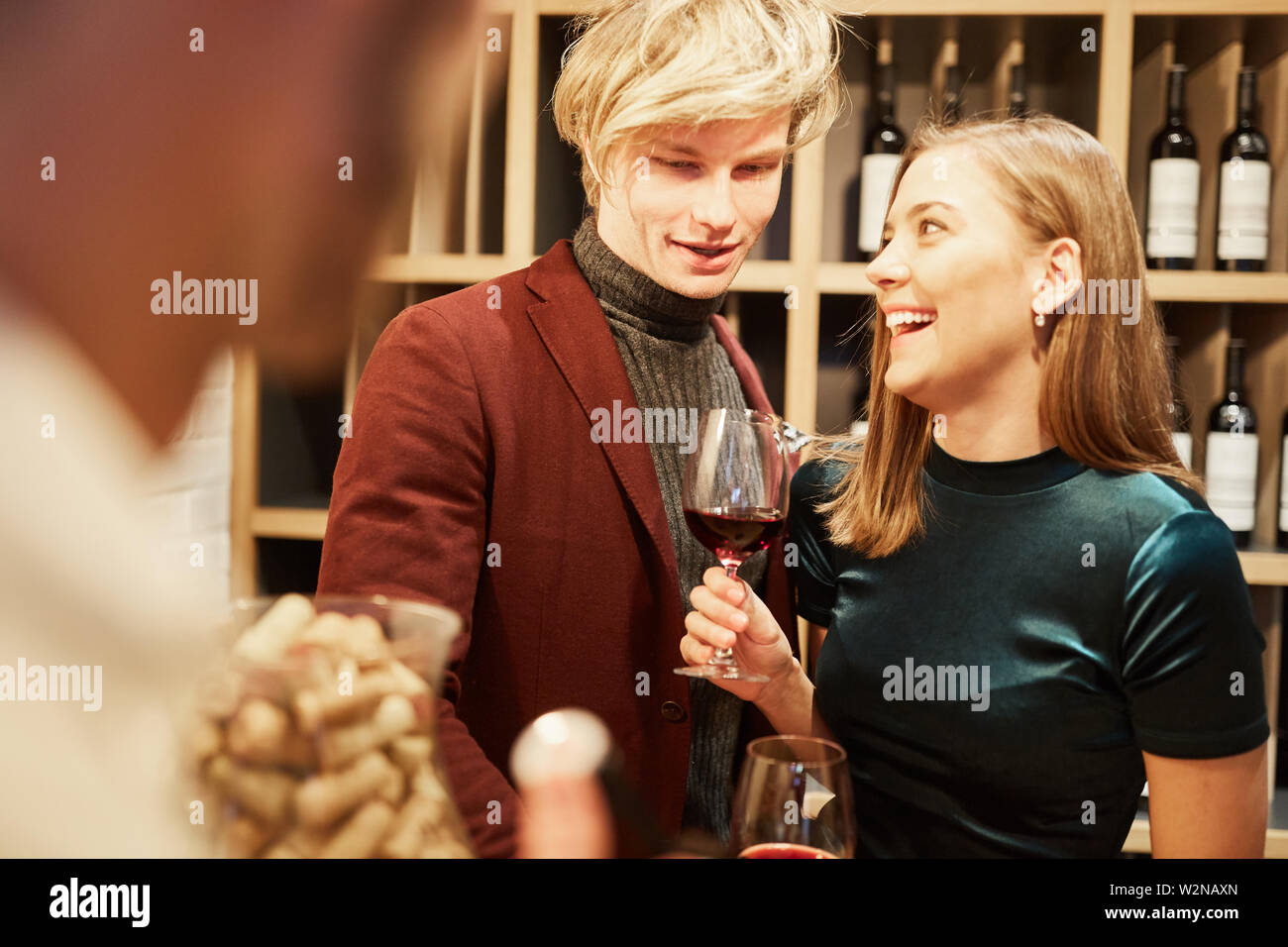 Young couple have fun tasting or tasting with a glass of red wine Stock Photo