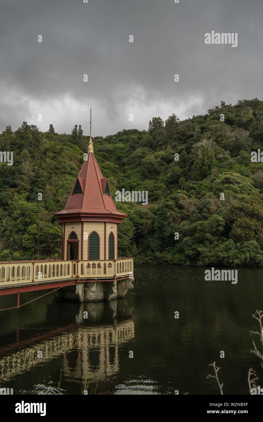 Historic pumphouse in the middle of a dam Stock Photo