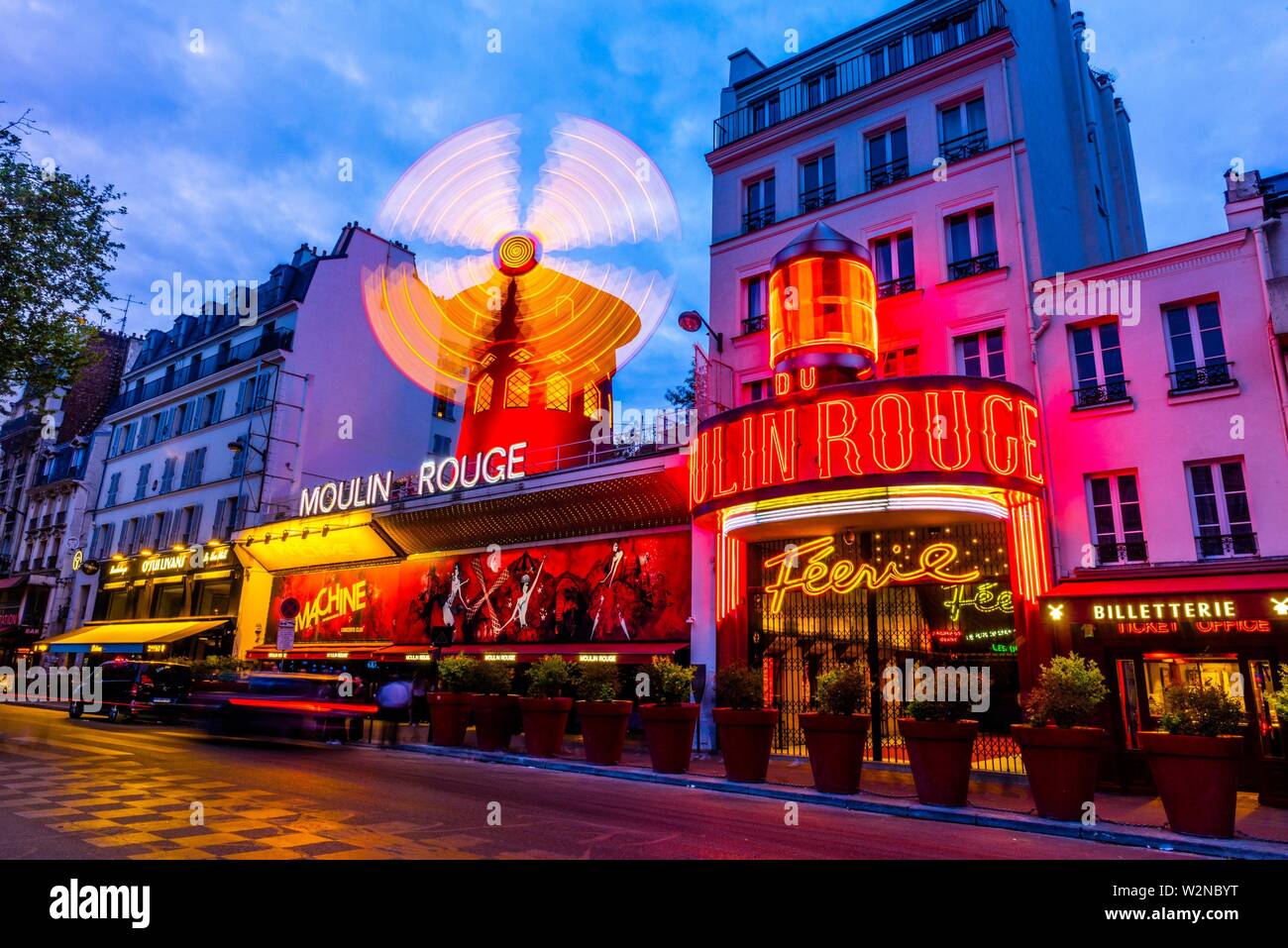 Moulin Rouge (French for Red Windmill) is a tourist attraction in Pigalle on Boulevard de Clichy, 18th arrondissement. It is best known as the Stock Photo